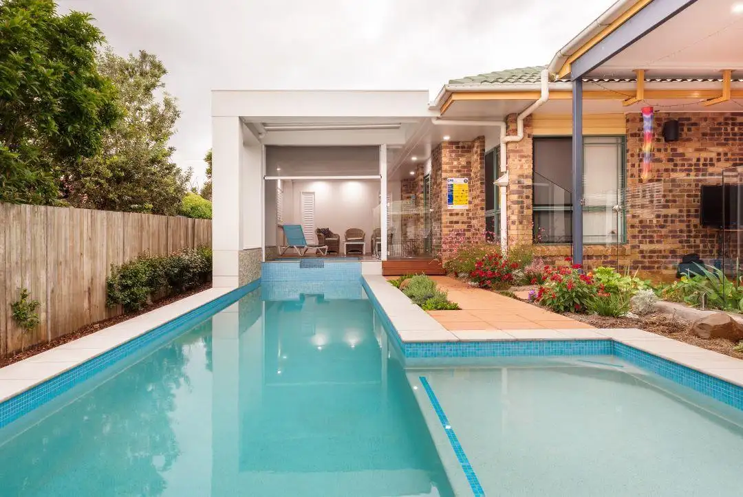 Custom swimming pool and shallow ledge by Garden City Pools Custom swimming pool and shallow ledge by Garden City Pools